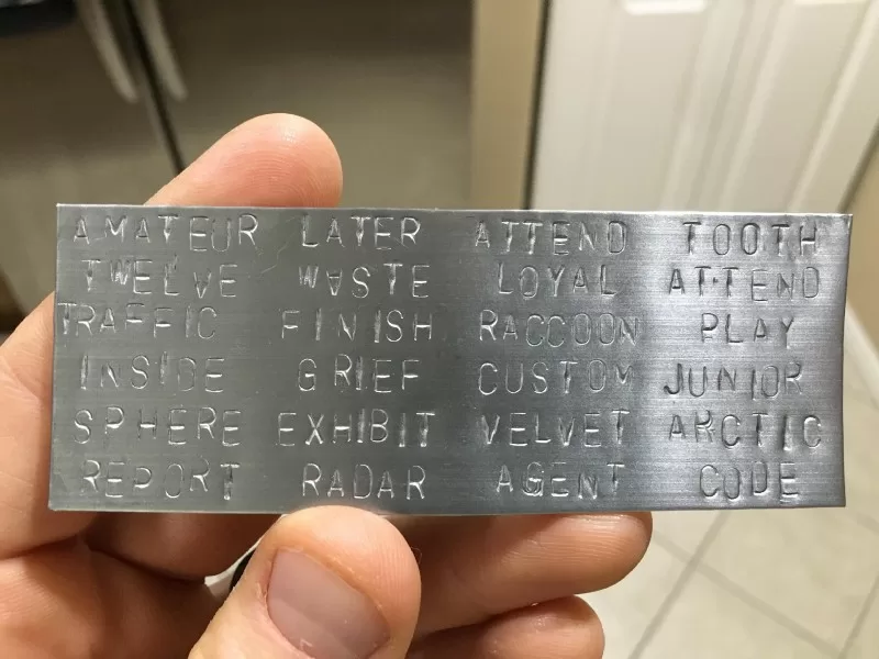 BIP39 seed words on a metal plate